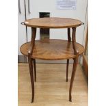 An Edwardian mahogany two-tier occasional table, oval form,