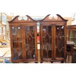 A pair of Bevan Funnell Georgian style mahogany wall hanging display cabinets.