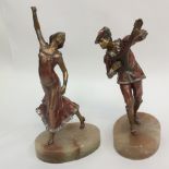 A pair of Art Deco bronzed spelter figures, mandolin player and his female dancing companion,