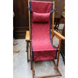 An early 20th Century solid beech folding campaign chair,