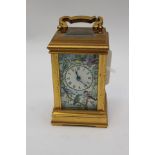 A miniature brass and enamelled carriage clock,