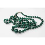 Two strings of malachite beads,