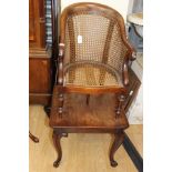 A Victorian mahogany child's high chair on stand, canework seat and back,
