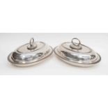 A pair of silver plated tureens,