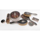 A matched early 20th Century eight piece tortoiseshell dressing set,