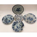 Four Chinese blue and white platters. Hand painted decoration. With a similar bowl.