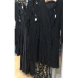 A collection of black items to include a black lace late 1920s/early 1930s cocktail dress,