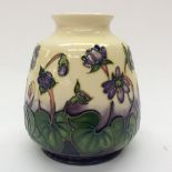 A Moorcroft vase in Hepatica pattern, measuring approx 15.