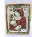 Terracotta wall plaque, Madonna and child. Dated 1632 (corner re-glued into place).