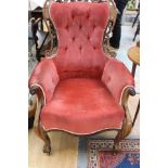 A Victorian mahogany gentleman's armchair, with a pierced crest rail, deep buttoned back,