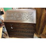 A George III and later oak bureau, the fall front enclosing a fitted interior,