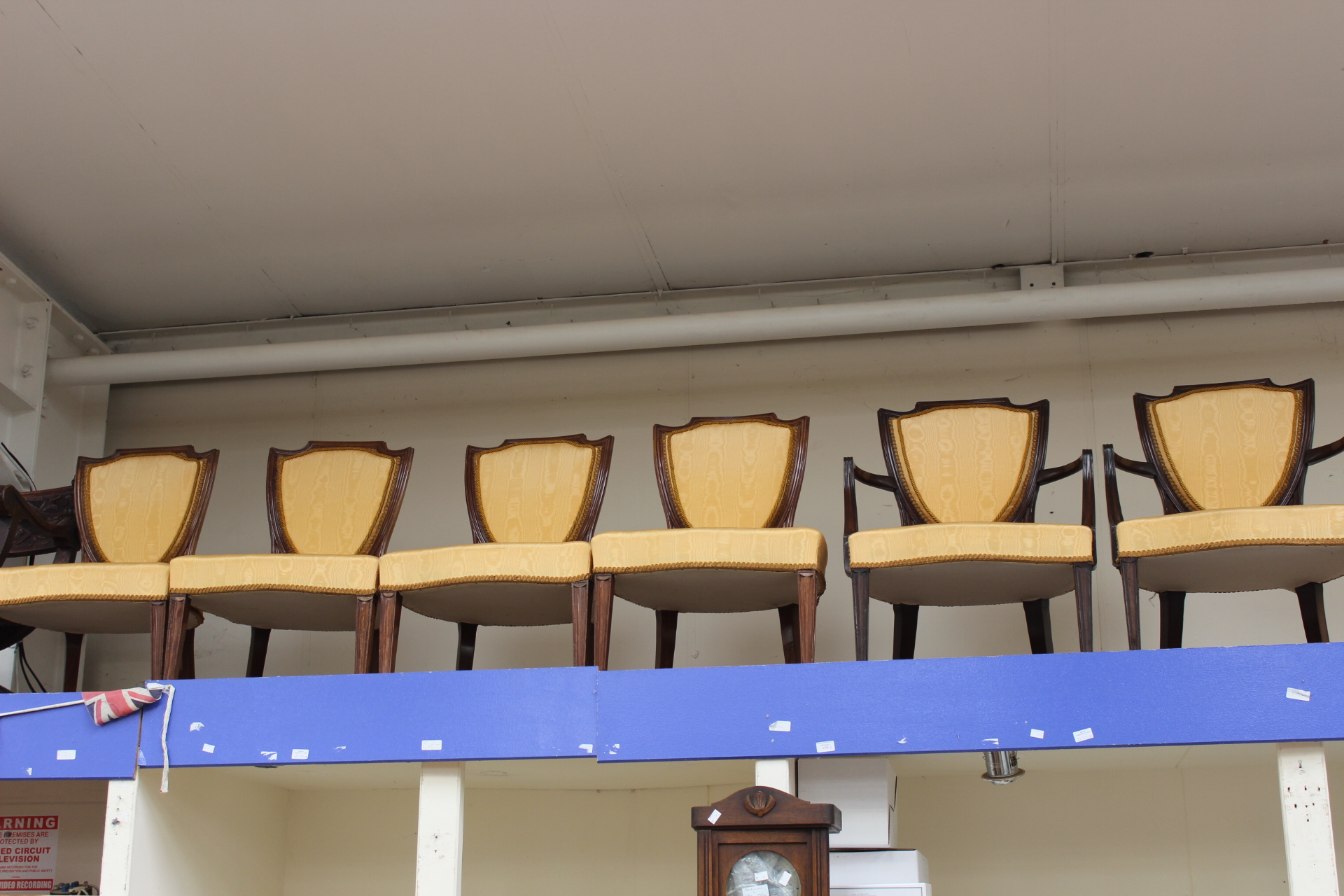 An set of eight early 20th Century shield back dining chairs,