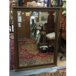 A very large gilt framed mirror