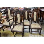 A set of 10 Victorian oak Carolean style dining chairs with carved crests, roped,