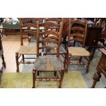 A set of four 19th Century ladder back chairs with rush seats.