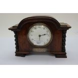 A presentation mantle clock 1928 with silver inscription cartouche,