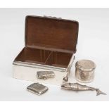 An Edward VII silver cigarette box, London 1903, a silver vesta case,