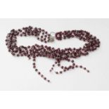 A garnet necklace with crystal glass spacer beads