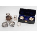 A boxed silver salt set, a pair of Victorian shell form salts, Birmingham,