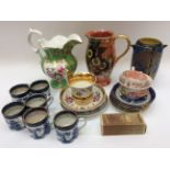 Six Booths blue and white coffee cans and saucers, along with German gilt cup and saucer,