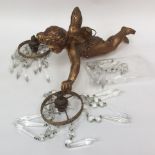 A gilt metal cherub light chandelier