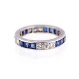 A diamond and sapphire full eternity platinum ring,