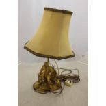 An early 20th Century gilt metal electric table lamp, in the form of a 17th Century artist,
