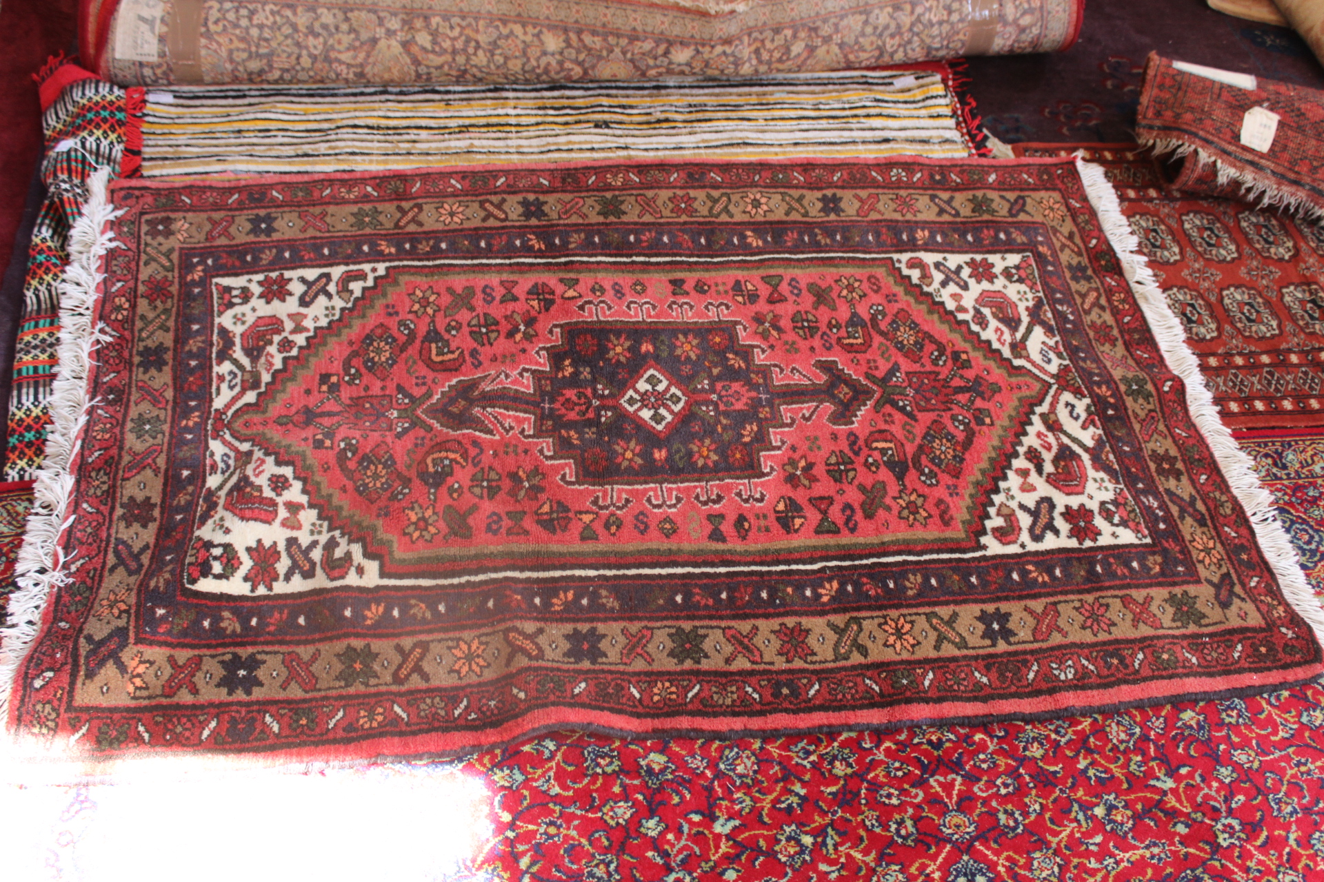 Hand knotted wool rug, red ground,