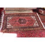 Hand knotted wool rug, red ground,