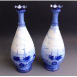 A pair of Royal Crown Derby vases, painted all around with sailing scenes By W.E.