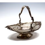 A Victorian oval silver swing handle basket, pierced scrollwork frieze and foliate border,