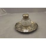 A Victorian circular bottle and silver stand