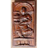 Oak late 16th Century thickly carved oak panel with folk art depiction of 'St Clare' carrying a