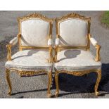A pair of 19th Century French giltwood upholstered open armchairs (2)