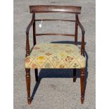 A George III mahogany open armchair, circa 1820, woolwork seat,