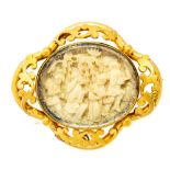 A Victorian gold and ivory oval brooch, the centre set with an oval ivory panel,