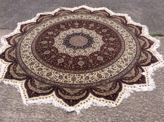 A Persian design circular rug,