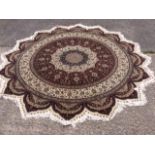 A Persian design circular rug,