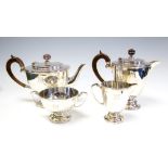 A George V silver four piece tea service comprising teapot, hot water jug, milk jug and sugar bowl,