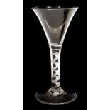 A Georgian style hand blown trumpet shaped wine glass, having a spiral air twist stem,
