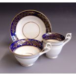 An English porcelain trio, tea and coffee cup and saucer, cobalt blue and gilt borders, pattern No.