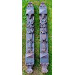 A large pair of 'Arts and Crafts' 19th Century carved terms with Egyptian Atlanta flowers,