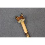 Ian Taylor, a hand crafted walking stick, the handle carved in the form of a foxes' head,