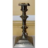 A mid 18th Century Paktong silver candlestick,