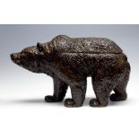 A late 19th Century Black Forest bear, cica 1890, realistically carved strolling, glass eyes,