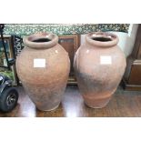 A pair of Tuscan Innerglazed terracotta jars, each impressed Carlo Bitossi Montelupoo Toscana,