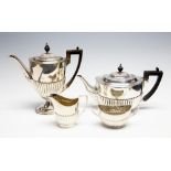 A late Victorian matched silver four piece tea and coffee service in the Georgina manner with