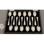 A George V set of twelve silver tea spoons, Sheffield 1928, having engraved intials to terminals,