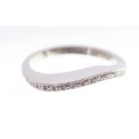 A diamond eternity ring, shaped to the front, fully set with brilliant cut diamonds in platinum,