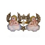 A Victorian diamond set and enamel double cherub brooch,